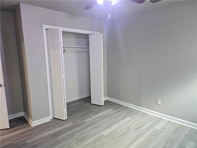 4134 Sierra St, Corpus Christi, TX 78410 - unfurnished bedroom featuring wood finished floors, a closet, and ceiling fan