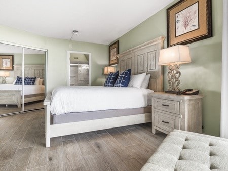 bedroom featuring dark hardwood / wood-style flooring and a closet