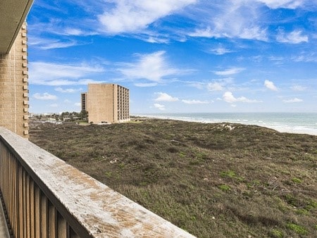 exterior space with a beach view and a water view