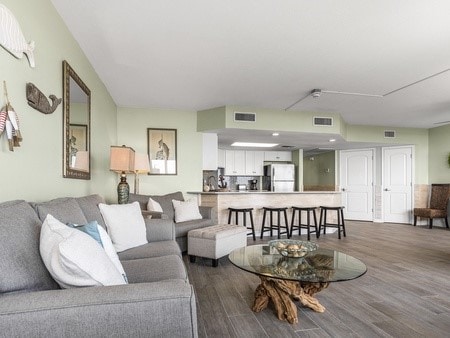 living room with dark hardwood / wood-style flooring