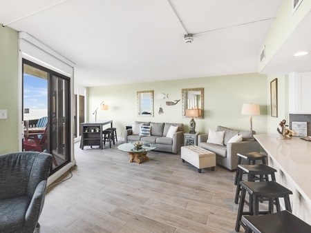 living room with light hardwood / wood-style flooring