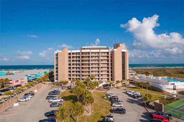 720 Access Rd Unit 1-A, Port Aransas, TX 78373 - view of apartment building / complex with uncovered parking and a water view
