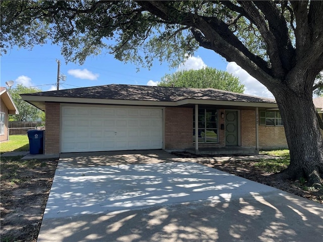 117 E Broadway Ave, Portland, TX 78374 - single story home featuring brick siding, driveway, and a garage