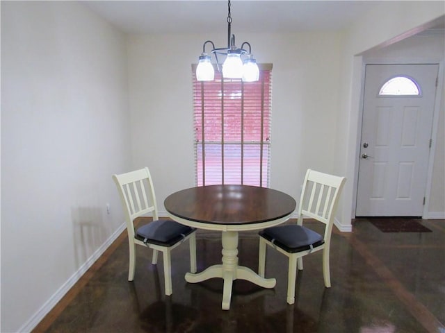 dining space featuring an inviting chandelier