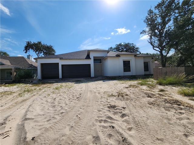 view of front of property featuring a garage