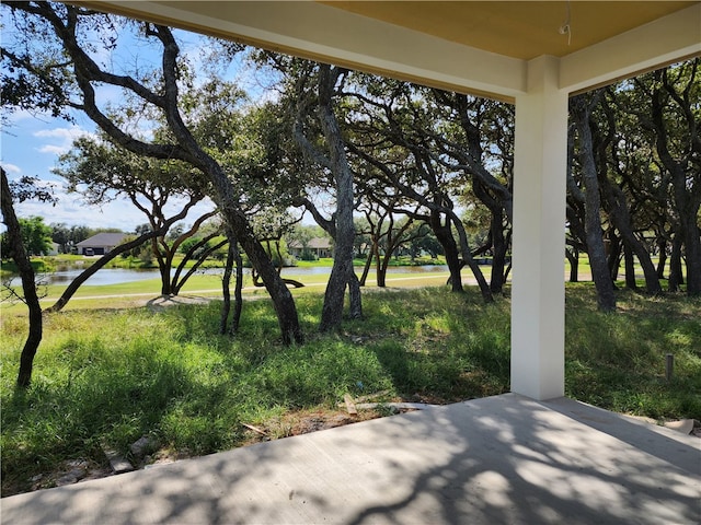 view of patio with a water view