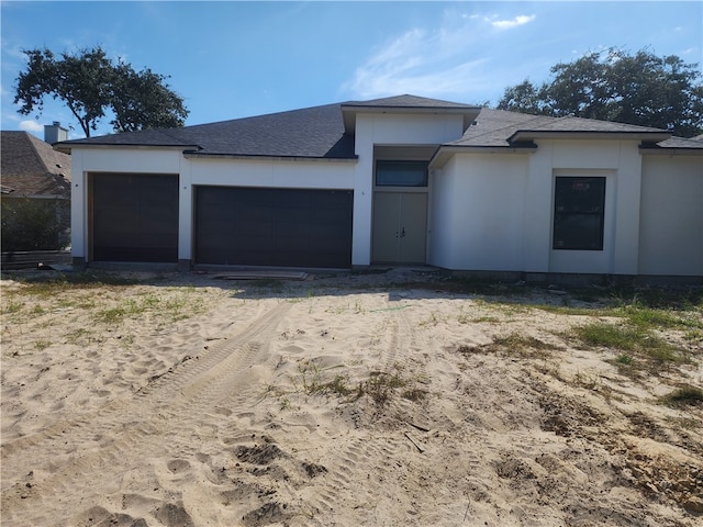 prairie-style house featuring a garage