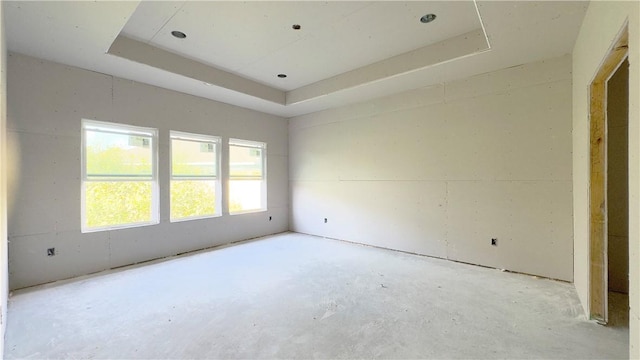 7617 Roman Dr, Corpus Christi, TX 78414 - spare room with a tray ceiling and unfinished concrete flooring