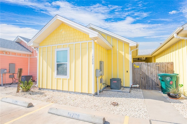 view of side of home featuring central AC unit