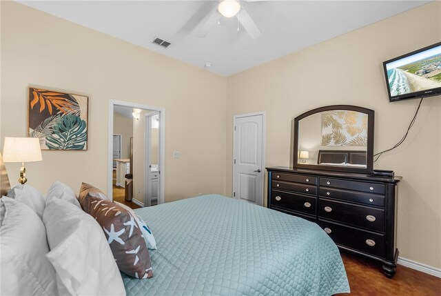 carpeted bedroom featuring ensuite bathroom and ceiling fan