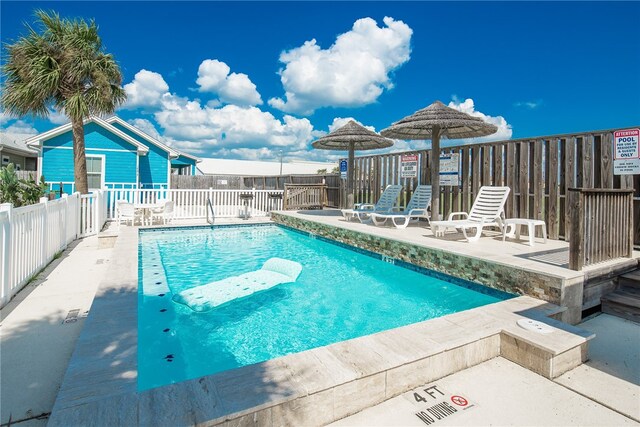 view of swimming pool featuring a patio area