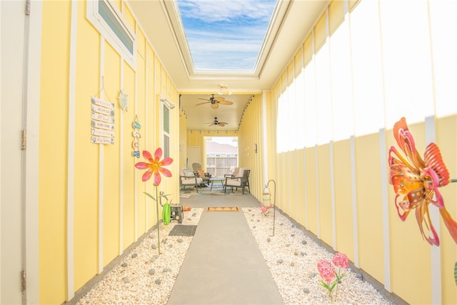 hallway featuring a skylight