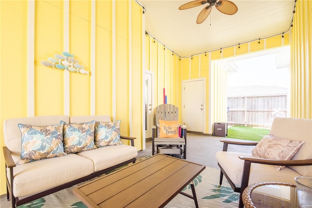 living room featuring ceiling fan and carpet floors