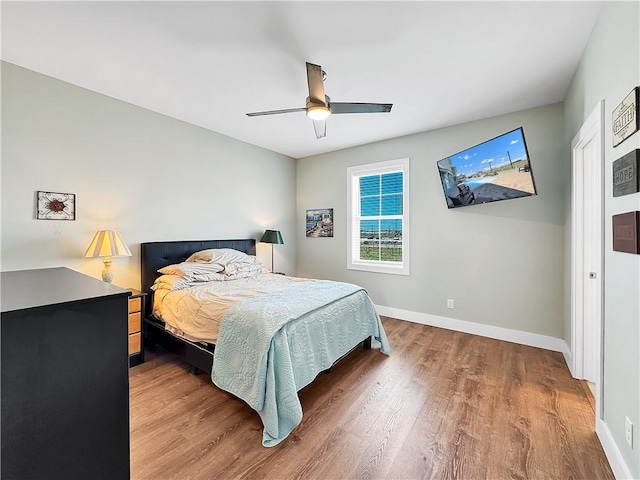 14307 Ridley Way, Corpus Christi, TX 78418 - bedroom featuring wood finished floors, baseboards, and ceiling fan