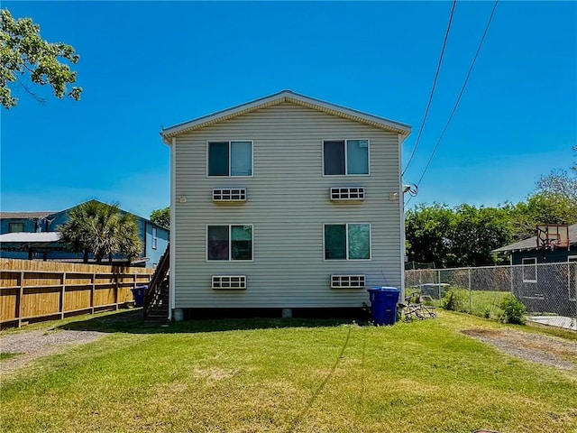 rear view of house with a lawn