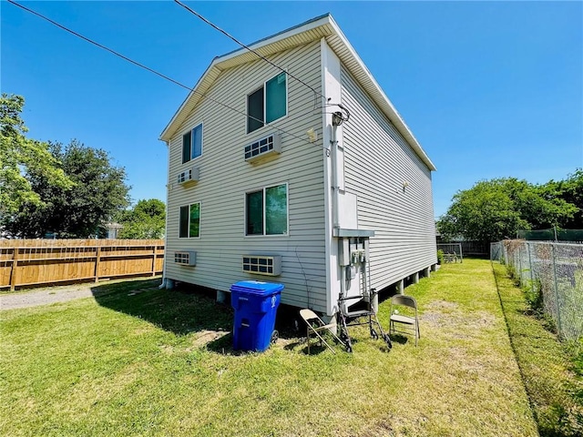 back of property featuring a lawn