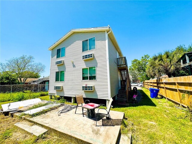 1612 7th St, Corpus Christi, TX 78404 - rear view of property with a fenced backyard, a patio, and stairway