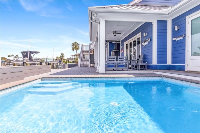 pool with a deck and stairway