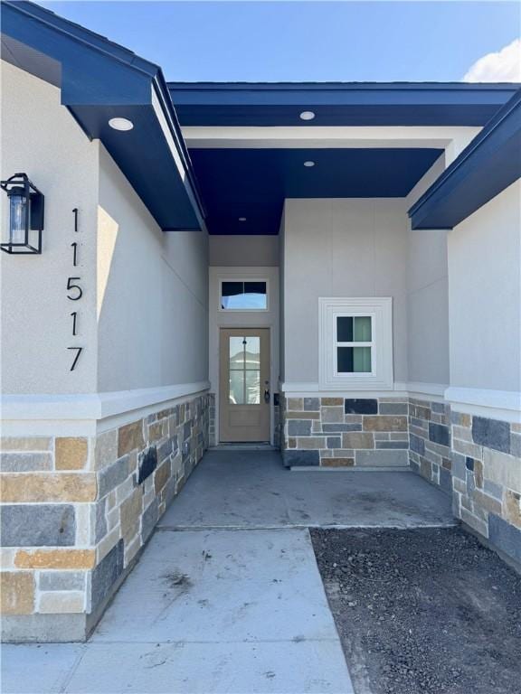 11517 Willowood Creek Dr, Corpus Christi, TX 78410 - doorway to property with stucco siding and stone siding