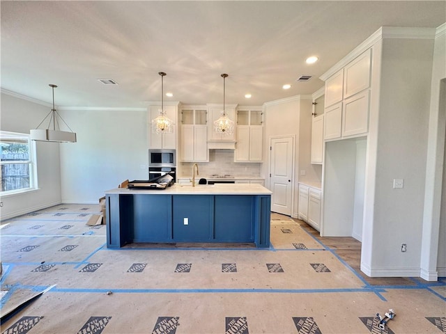 11517 Willowood Creek Dr, Corpus Christi, TX 78410 - kitchen with appliances with stainless steel finishes, white cabinets, decorative backsplash, recessed lighting, and light countertops