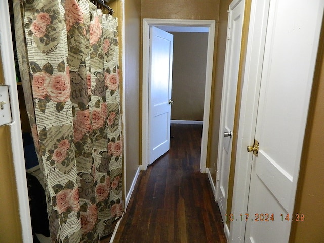 corridor featuring dark hardwood / wood-style flooring