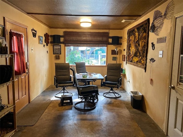 sitting room featuring concrete floors and a textured ceiling