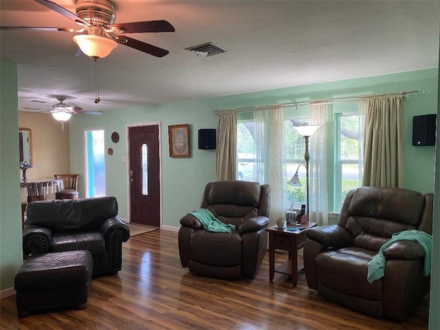 living room with hardwood / wood-style flooring and ceiling fan