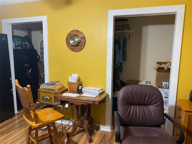 living area with hardwood / wood-style flooring