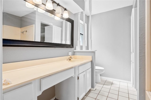 full bath featuring toilet, tile patterned flooring, baseboards, and vanity