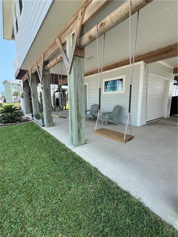 162 La Concha Blvd Unit 29, Port Aransas, TX 78373 - view of patio with an attached garage