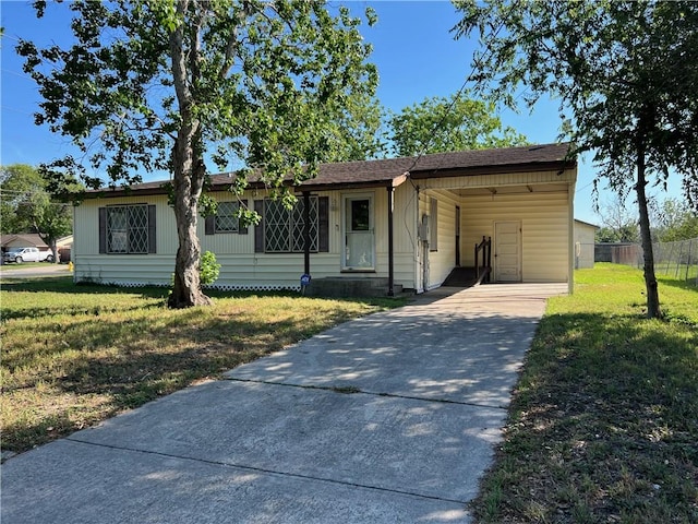 10801 Mayfield Dr, Corpus Christi, TX 78410 - view of front of home with concrete driveway and an attached carport