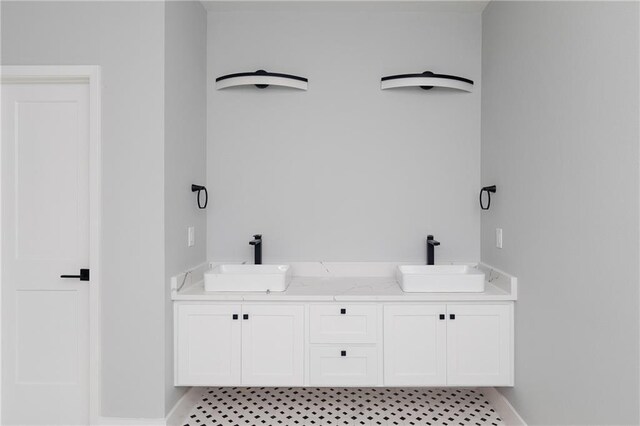 bathroom with tile patterned flooring and vanity