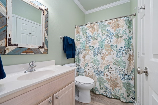 bathroom with toilet, crown molding, vanity, a shower with shower curtain, and hardwood / wood-style flooring