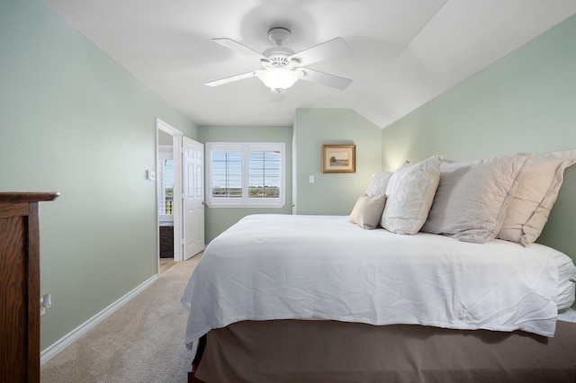 bedroom with vaulted ceiling, light carpet, and ceiling fan