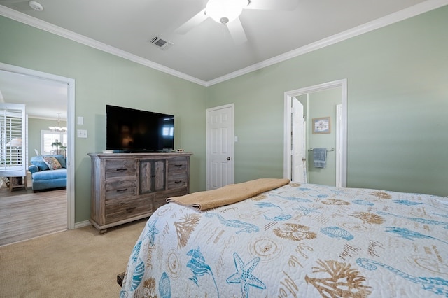 carpeted bedroom with crown molding and ceiling fan with notable chandelier