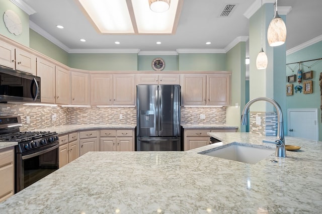 kitchen with sink, ornamental molding, appliances with stainless steel finishes, pendant lighting, and light stone countertops