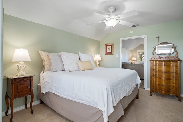 bedroom featuring vaulted ceiling, light colored carpet, and ceiling fan