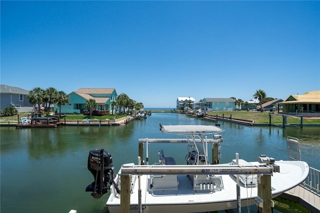 dock area featuring a water view and a residential view