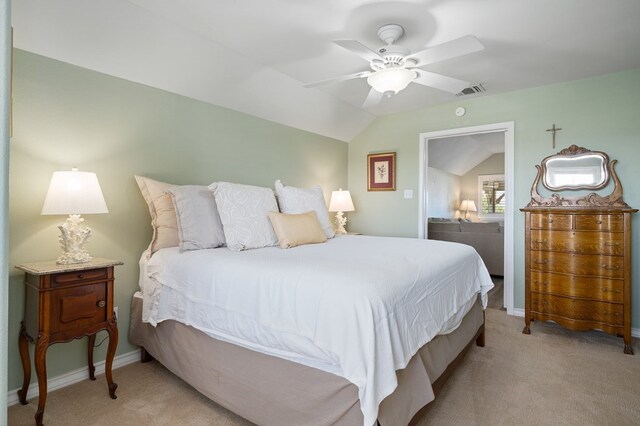 bedroom featuring visible vents, light colored carpet, a ceiling fan, and vaulted ceiling