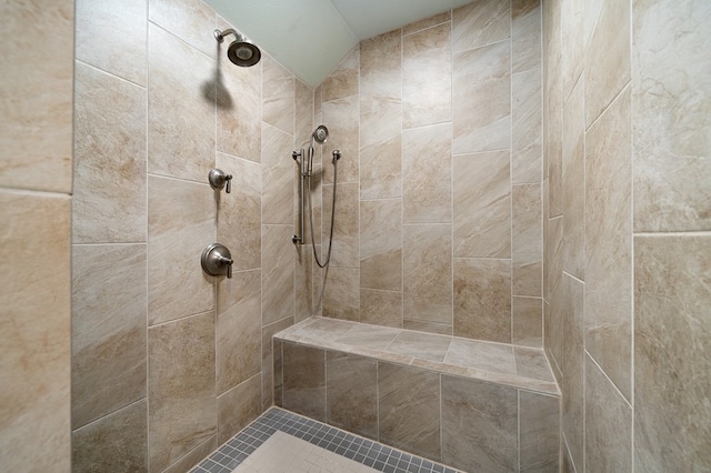 bathroom with a tile shower