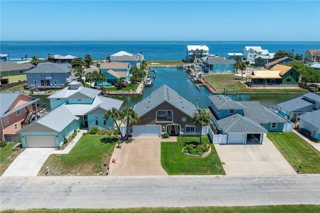 aerial view with a residential view and a water view