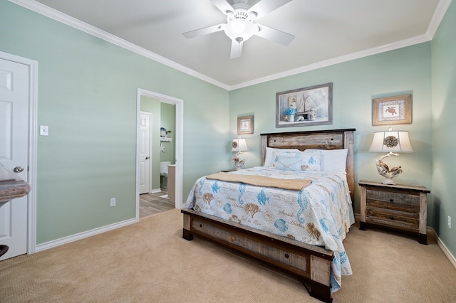 carpeted bedroom featuring ornamental molding, connected bathroom, and ceiling fan