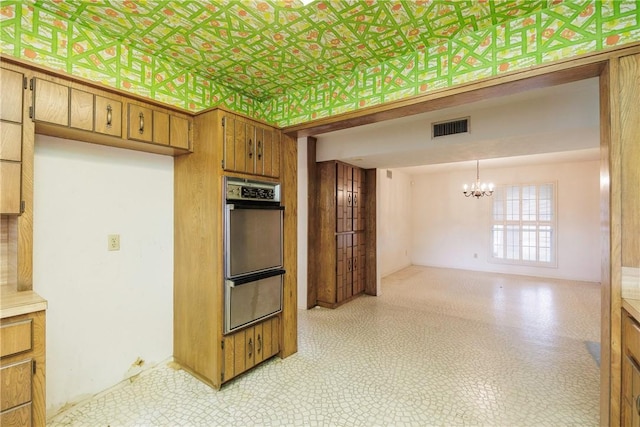 kitchen with a chandelier and decorative light fixtures