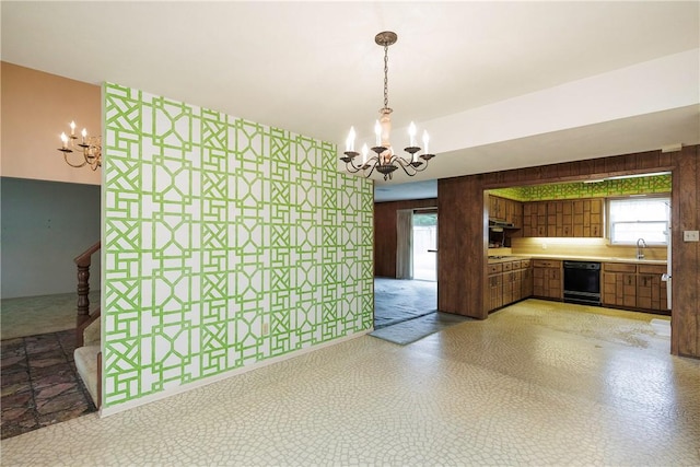 4826 Olympia Dr, Corpus Christi, TX 78413 - unfurnished dining area with a chandelier, wood walls, and light flooring