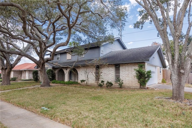 4826 Olympia Dr, Corpus Christi, TX 78413 - traditional-style house featuring a shingled roof, an attached garage, concrete driveway, and brick siding