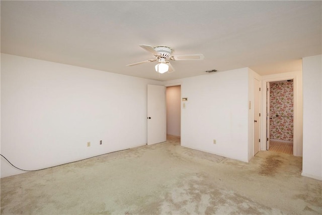 carpeted empty room with ceiling fan