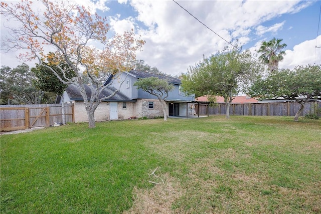 4826 Olympia Dr, Corpus Christi, TX 78413 - fenced backyard with a patio