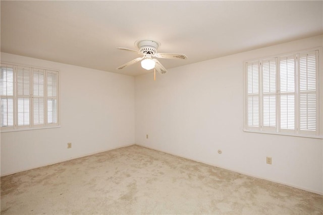 4826 Olympia Dr, Corpus Christi, TX 78413 - spare room featuring healthy amount of natural light, carpet, and ceiling fan