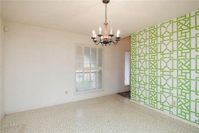 4826 Olympia Dr, Corpus Christi, TX 78413 - spare room featuring a chandelier and baseboards