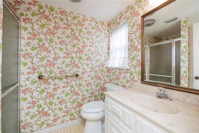 4826 Olympia Dr, Corpus Christi, TX 78413 - bathroom with wallpapered walls, vanity, and a shower with door